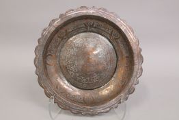 AN EARLY 16TH CENTURY SYRIAN MAMLUK ENGRAVED TINNED COPPER DISH.