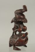 A FINE CHINESE CARVED BAMBOO FIGURE OF AN ACROBAT UPON A LARGE TOAD, 19cm high.