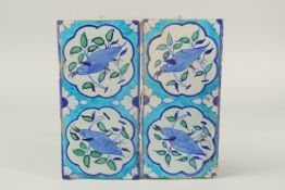 A PAIR OF 19TH CENTURY INDIAN OR NORTH INDIAN MULTAN GLAZED POTTERY TILES, with bird designs, 30cm x