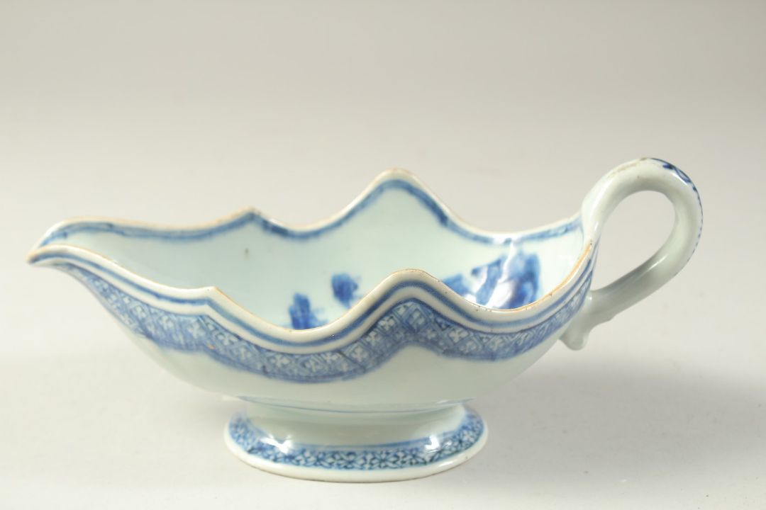 A 19TH CENTURY CHINESE BLUE AND WHITE PORCELAIN SAUCE BOAT, the interior decorated with flora, 23. - Image 1 of 4
