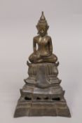 A LAO NORTH THAI BRONZE BUDDHA ON DETACHABLE STAND, 30cm high overall.