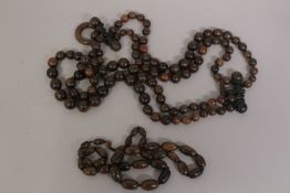 A COLLECTION OF RHINO HORN BEADS, (2).