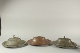 A COLLECTION OF THREE 19TH CENTURY OTTOMAN SIGNED AND DATED COPPER LIDDED OVAL DISHES.