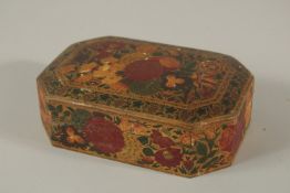 A 19TH CENTURY INDIAN KASHMIRI GILDED AND LACQUERED PAPIER MACHE BOX, SIGNED BY SUFFERING MOSES,