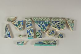 A COLLECTION OF TWELVE 16TH CENTURY OTTOMAN TURKISH TILE FRAGMENTS, largest 13cm, (12).