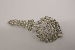A FINE INDIAN OR SRI LANKAN SILVER AND WHITE SAPHIRE TURBAN ORNAMENT, 8cm long.