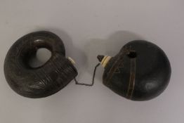 TWO 18TH-19TH CENTURY MUGHAL INDIAN LEATHER MOUNTED POWDER FLASKS, with bone mounts, 16cm wide.