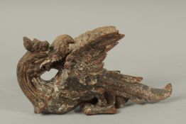 A FINE 17TH CENTURY SOUTH INDIAN POLYCHROMED CARVED WOODEN YALI CREATURE, 29.5cm long.