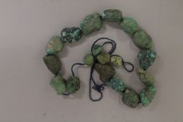 A STRING OF 19TH CENTURY TIBETAN NATURAL TURQUOISE STONES.