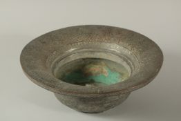 AN 18TH CENTURY OR EARLIER PERSIAN TINNED COPPER BASIN, 31.5cm diameter.
