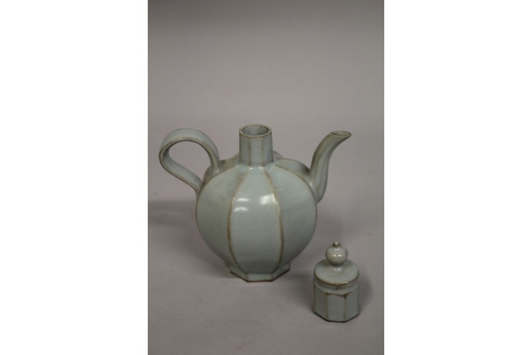 A CHINESE CELADON GLAZE PORCELAIN OCTAGONAL-FORM LIDDED TEAPOT, 19cm high. - Image 2 of 4