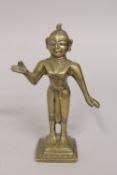 AN INDIAN GILDED BRONZE FIGURE, 21cm high.