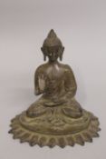 A BRONZE SEATED BUDDHA, upon a lotus base, 19cm high.
