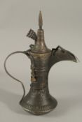 A FINE AND LARGE ARAB OMANI IT EMARATI COFFEE POT DALLAH, 39cm high.
