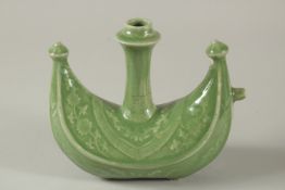 A RARE CHINESE CELADON BOAT SHAPE EWER MADE FOR THE ISLAMIC MARKET, 18.5cm wide, 17cm high.