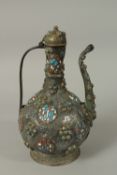 A 18TH CENTURY TURKUSH OTTOMAN KAYSARI ENGRAVED TINNED COPPER EWER, with enamelled decoration,
