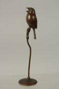 A BRONZE OKIMONO OF A BIRD, raised on a stalk, 17cm high.