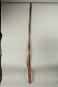 A LONG INDIAN MATCHLOCK RIFLE, 186cm long.