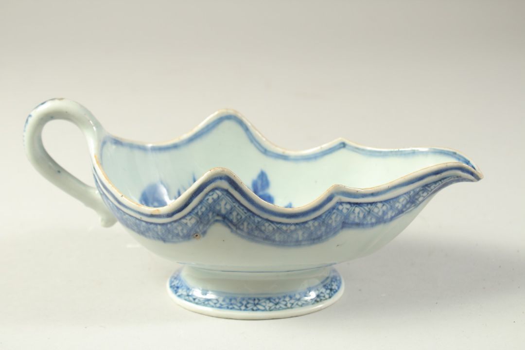 A 19TH CENTURY CHINESE BLUE AND WHITE PORCELAIN SAUCE BOAT, the interior decorated with flora, 23. - Image 2 of 4