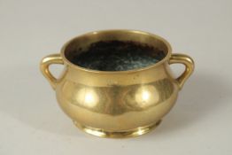 A FINE CHINESE GILT BRONZE TWIN HANDLE CENSER, the base bearing six-character mark, 13.5cm wide (