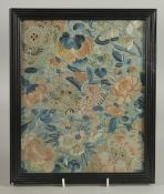 AN EARLY 20TH CENTURY CHINESE EMBROIDERED SILK TEXTILE FRAGMENT, framed and glazed, textile 27cm x