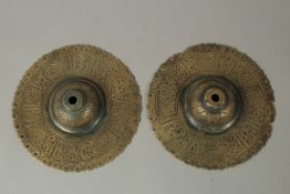 A PAIR OF 12TH-13TH CENTURY PERSIAN SELJUK KHURASSAN ENGRAVED BRONZE DOOR BOSSES, each 16cm