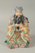 A LARGE 19TH CENTURY JAPANESE KUTANI PORCELAIN FIGURE of a bearded man adorned in traditional