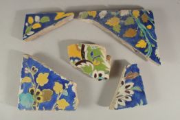COLLECTION OF FIVE 17TH CENTURY PERSIAN SAFAVID TILES FRAGMENTS, (5)