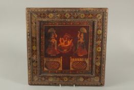 A FINE 19TH CENTURY SOUTH INDIAN TANJORE PAINTING OF SEATED GANESH, with a border of reverse-glass