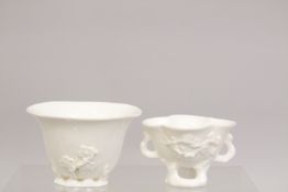 TWO DEHUA PORCELAIN LIBATION CUPS, largest 9cm wide.