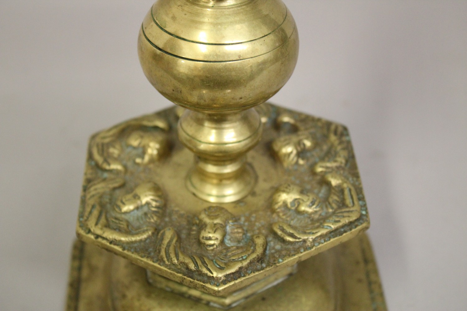 A 17TH-18TH FLEMISH BRASS CANDLESTICK, with cherubs, 28cm high. - Image 3 of 4