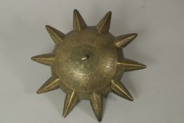 A FINE EARLY ISLAMIC POSSIBLY MAMLUK ENGRAVED BRONZE MULTI-SPOUTED OIL LAMP, 26cm wide.