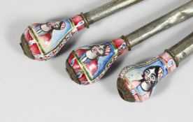 THREE 19TH CENTURY PERSIAN QAJAR ENAMELLED HUQQA MOUTH PIECES, the enamelled ends decorated with