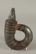 A 18TH - 19TH CENTURY ARAB OMANI SILVER MOUNTED POWDER FLASK, 21cm long.