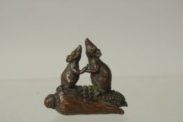 A BRONZE OKIMONO OF TWO RATS on a corn cob, 4cm high.