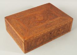 A VERY FINE AND LARGE 19TH CENTURY PERSIAN CARVED WOOD BOX, the hinged lid bearing a central roundel