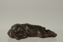 A BRONZE OKIMONO OF A SLEEPING DOG, 9.5cm long.