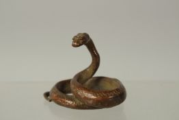 A BRONZE OKIMONO OF A SNAKE, 4.5cm high.