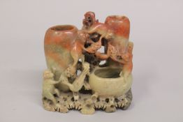 A CHINESE CARVED SOAPSTONE GROUP, depicting monkeys, 15.5cm high.