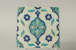 A 16TH CENTURY OTTOMAN TURKISH IZNIK TILE, 25cm x 23.5cm.