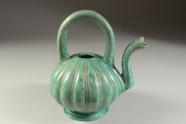 AN UNUSUAL 19TH CENTURY OR EARLIER INDIAN TURQUOISE GLAZED POTTERY EWER, 20cm high.