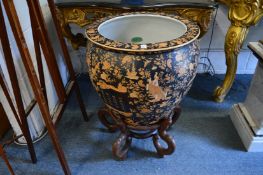 A very large pair of Chinese fish bowls on hardwood stands.