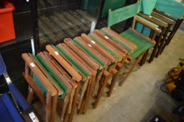 A set of six hardwood and green canvas folding directors style chairs.