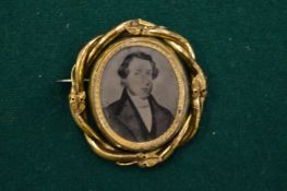 A Victorian portrait brooch.