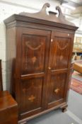A Sheraton revival inlaid mahogany two door wardrobe.