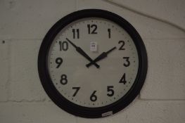 Circular wall clock.