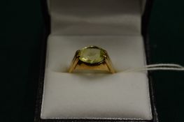 A gold and citrine ring, size N.