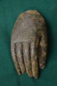 A small bronze model of a hand.