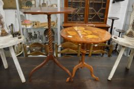 Two inlaid mahogany tripod tables.