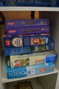 A quantity of jigsaw puzzles.